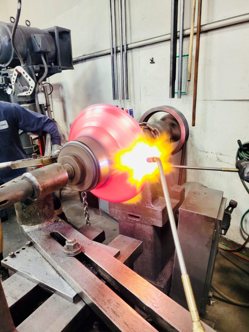 Forming of metal flange with heat from torch